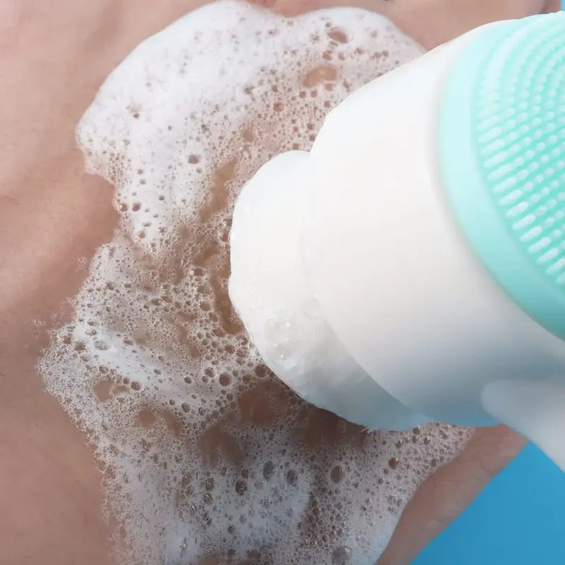 New Magna SilkCleanse Pro 2-in-1 Silicone Face Brush - Woman using silicone side of face brush for gentle facial massage and cleansing