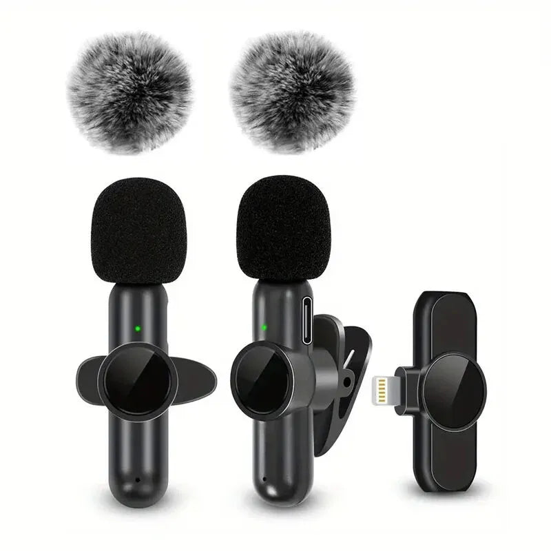 Two microphones with windshields and a clip-on device on a white background
