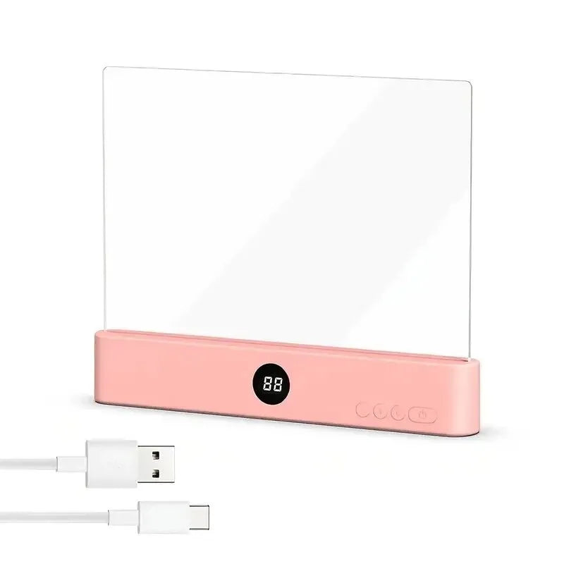 Pink electronic device with a digital display and USB cable on a white background