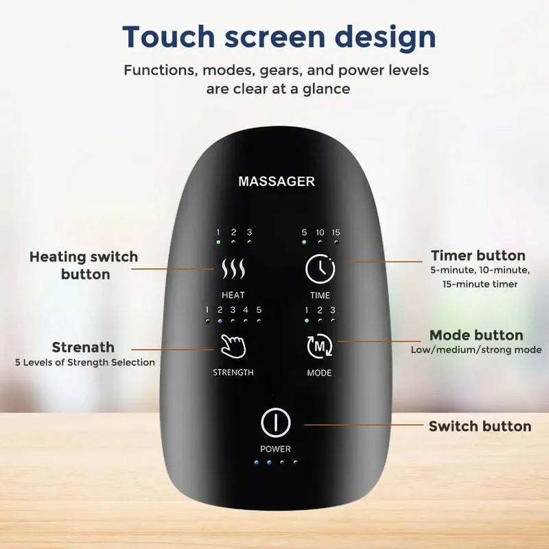 Black handheld massager with labeled buttons on a wooden surface