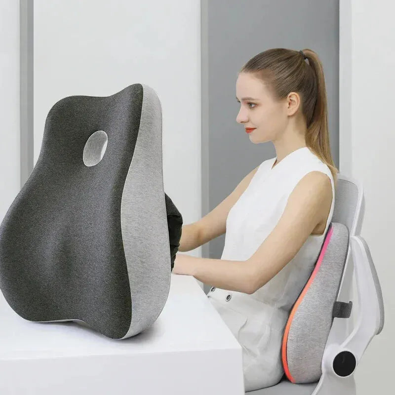 Woman using a back massager with a gray and black design