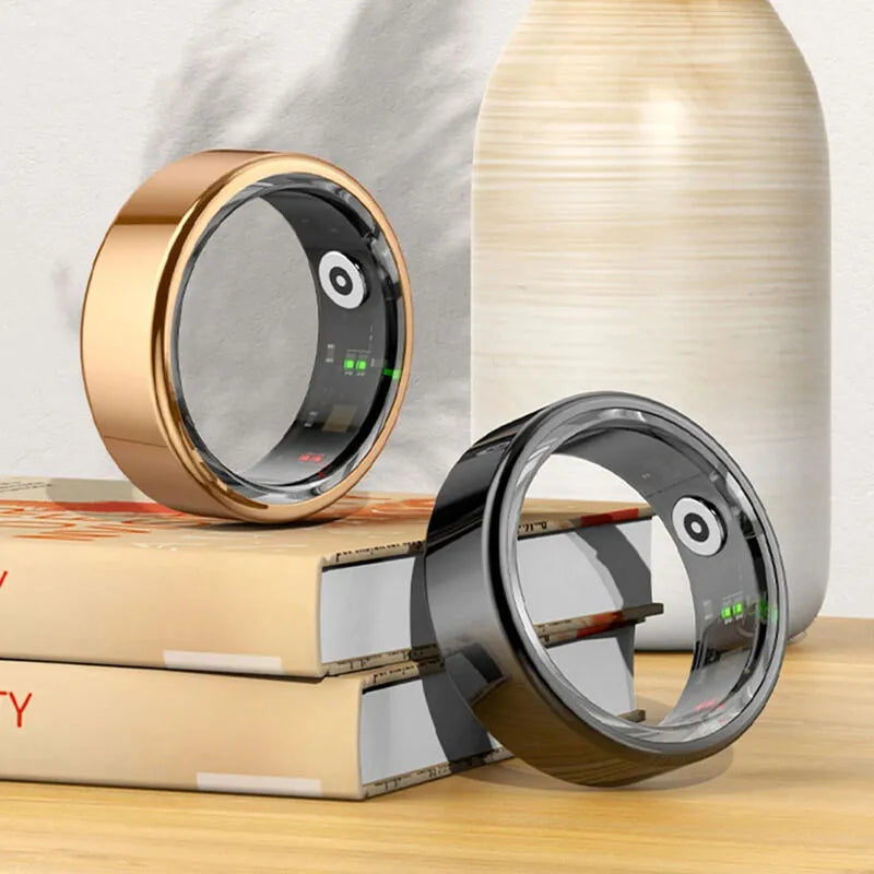 Two metallic ring-shaped devices on a stack of books with a neutral background