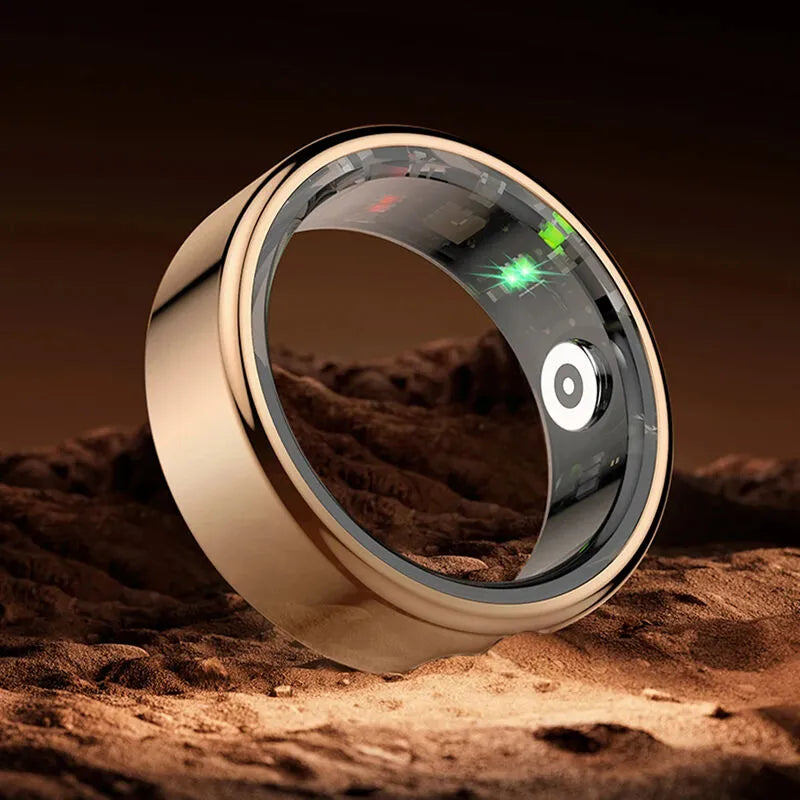 Smart ring with digital display on a sandy surface