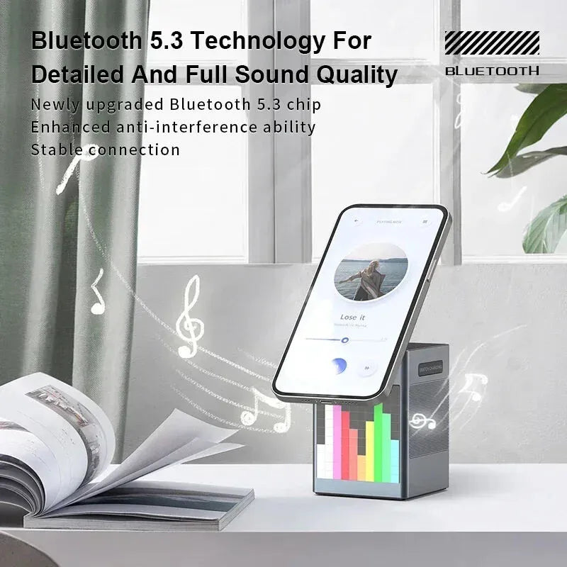 Smartphone dock with Bluetooth 5.3 technology on a desk with a book and plant in the background