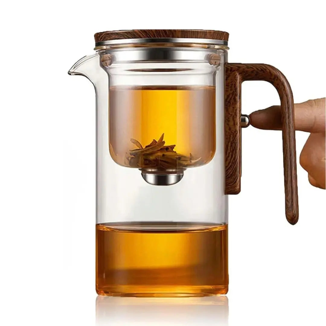 New Magna TeaZen Pro glass teapot with wooden handle showing golden brewed tea - gravity infusion teapot with separated tea leaves in upper chamber - elegant minimalist design with borosilicate glass construction